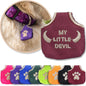 Burgundy Dog Tag Silencer shown with a variety of colors and with a brown dog